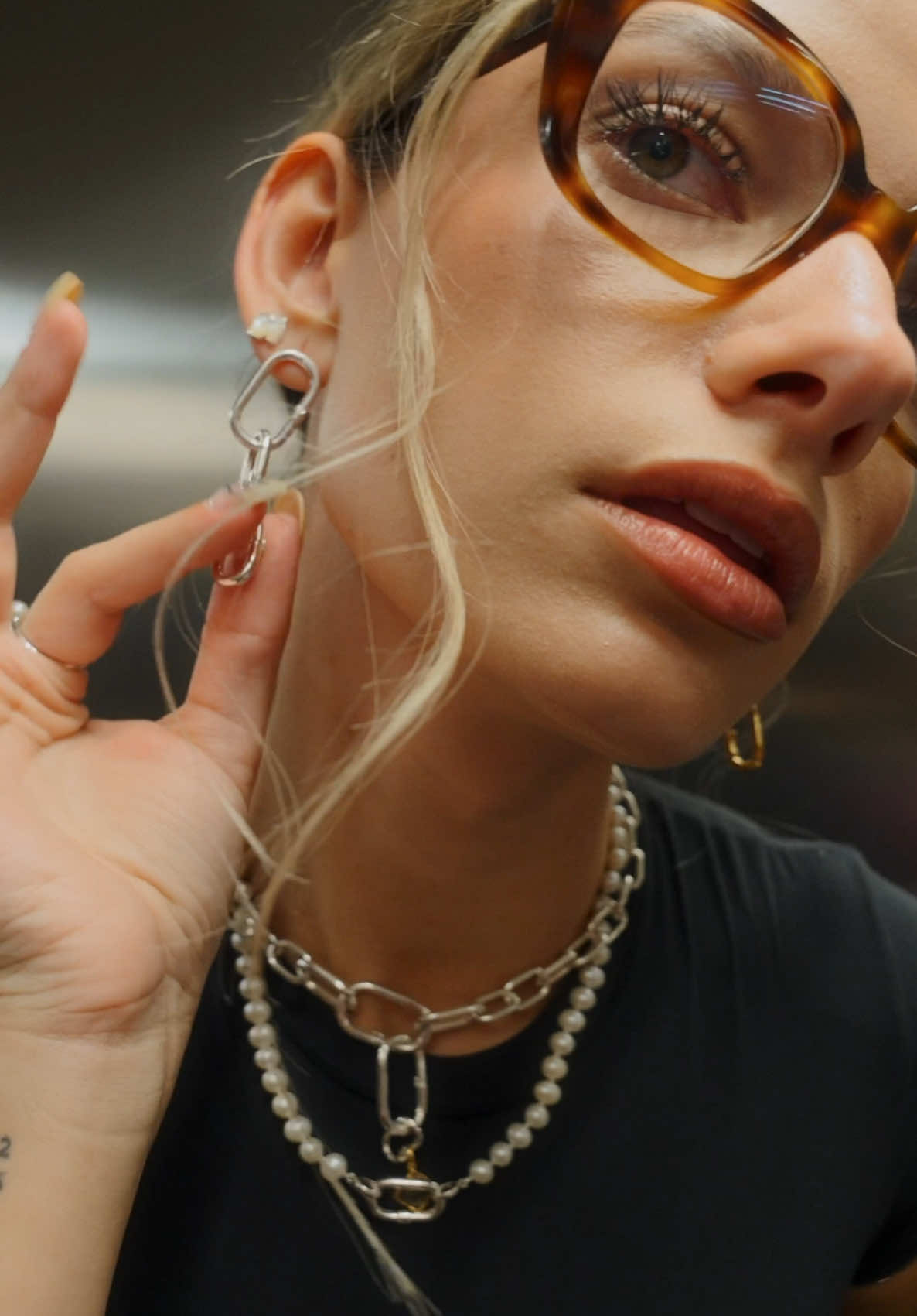 TikTok post by @inezlis for TOUS. Caption reads: in rush 👀 with @TOUS  reklama .