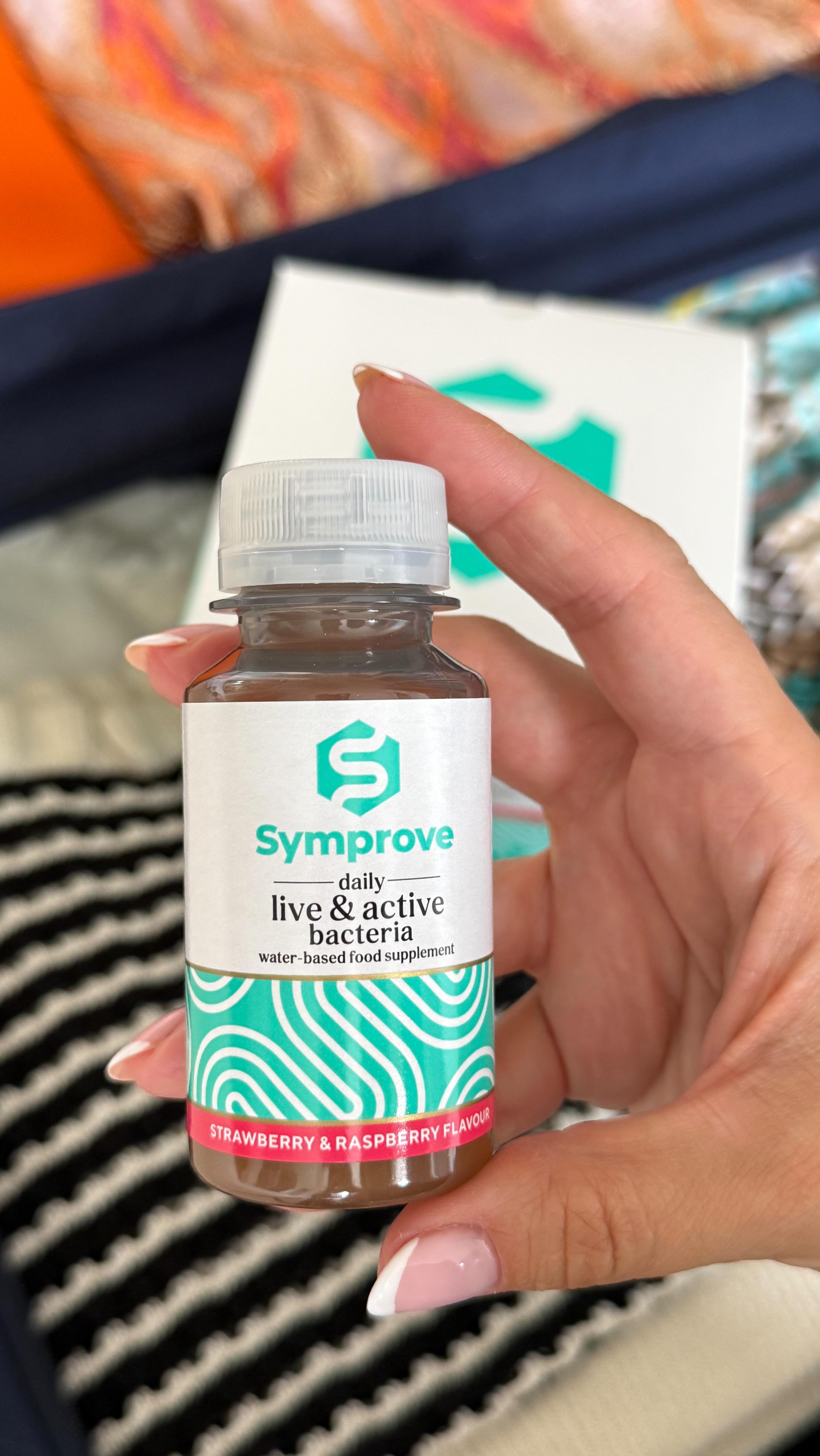 Instagram post by @ria.elaina for Symprove. Caption reads: Consistently taking my Symprove wherever I am.....