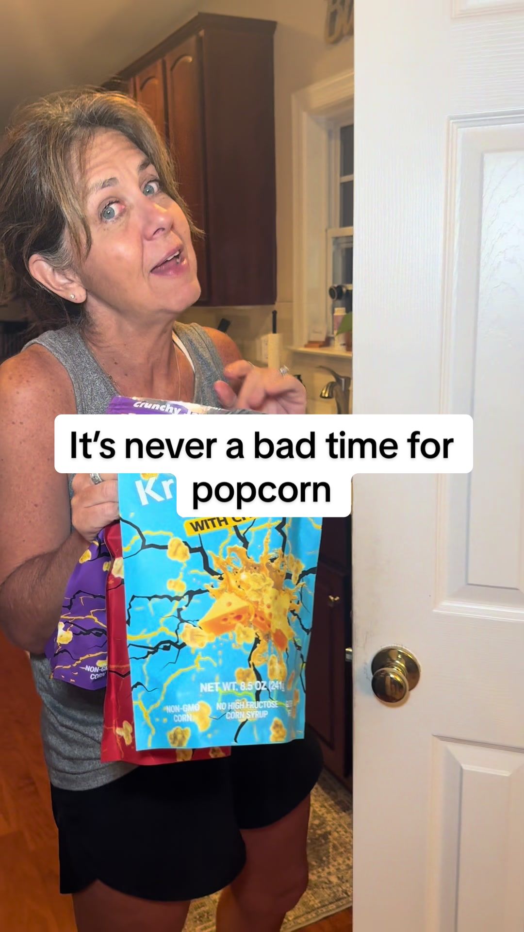 TikTok post by @nanalovesrunning for KrackCorn Popcorn. Caption reads: [...] munchies? Grab some flavor with KrackCorn....