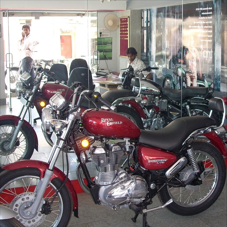 Instagram post by @bigbearbangalore for Royal Enfield. Caption reads: A moment frozen in time — mid 2009. HSR Services,....