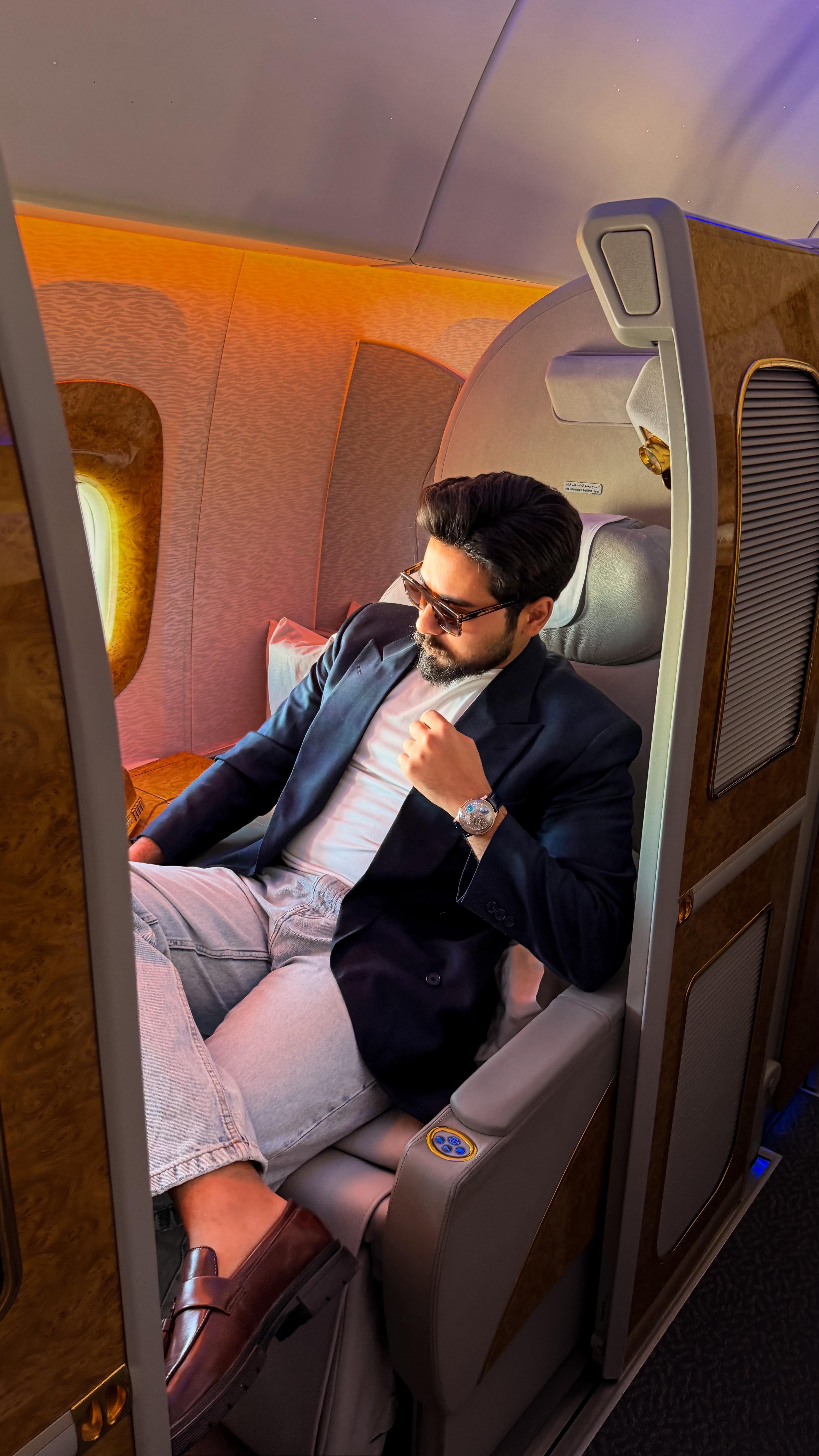 Instagram post by @dr.etman01 for Emirates. Caption reads: Above the clouds, time slows and elegance takes....