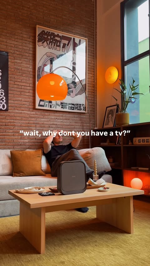 Instagram post by @cata.haus for XGIMI. Caption reads: [...] until it’s time for movie night :) 🧡....