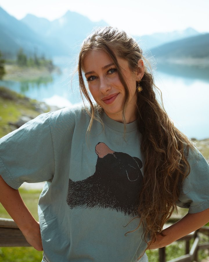 Instagram post by @chloe.chapdelaine for Travel Alberta. Caption reads: Could bear-ly contain my excitement bumping into....