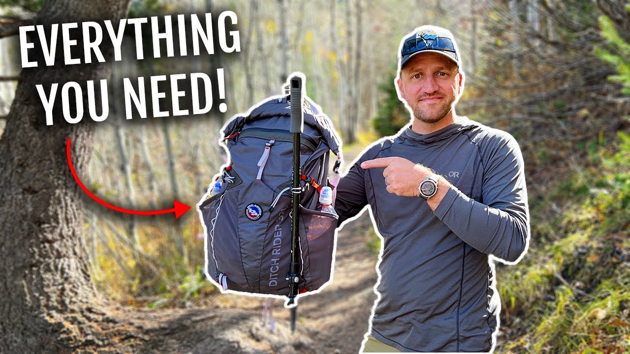 YouTube post by @BackcountryExposure for Kizer Knives. Caption reads: Day Hiking For Beginners · Essential Gear To Take....