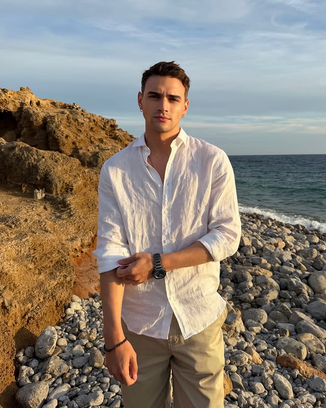 Instagram post by @gabriel.guevara for Armani Exchange. Caption reads: [...] A preview of summer in Ibiza with....