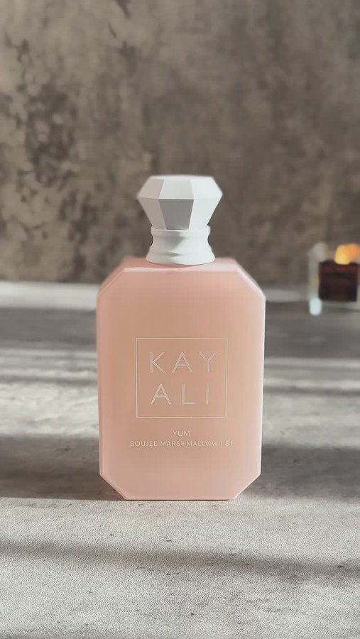 Instagram post by an influencer for KAYALI FRAGRANCES. Caption reads: Yum Boujee Marshmallow @kayali 🍬 Notes: Apple,....