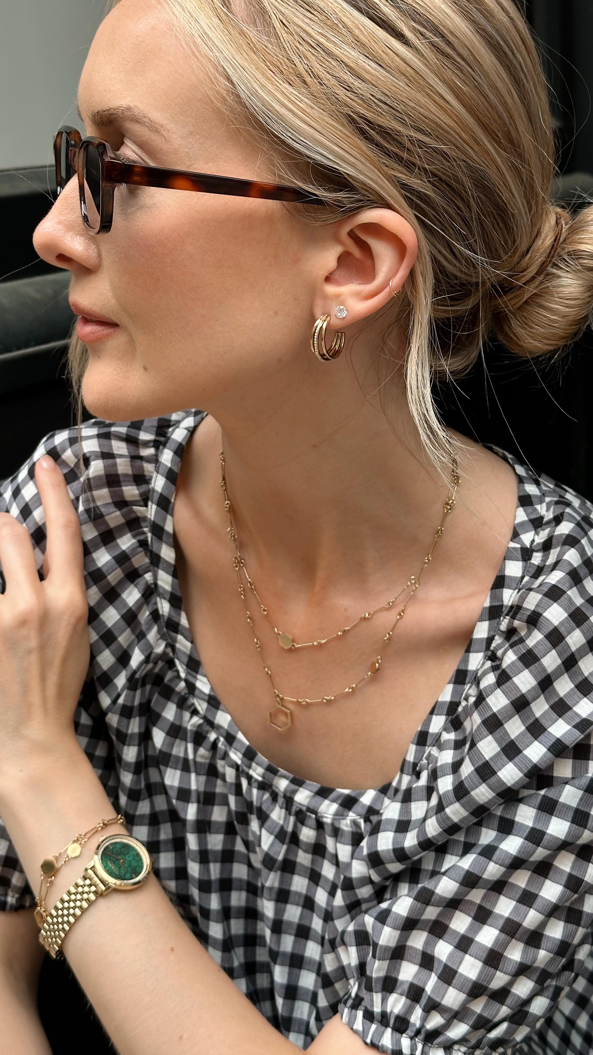 Instagram post by @chloekathbutler for Olivia Burton. Caption reads: Find your future classics with Olivia Burton 🌞My....