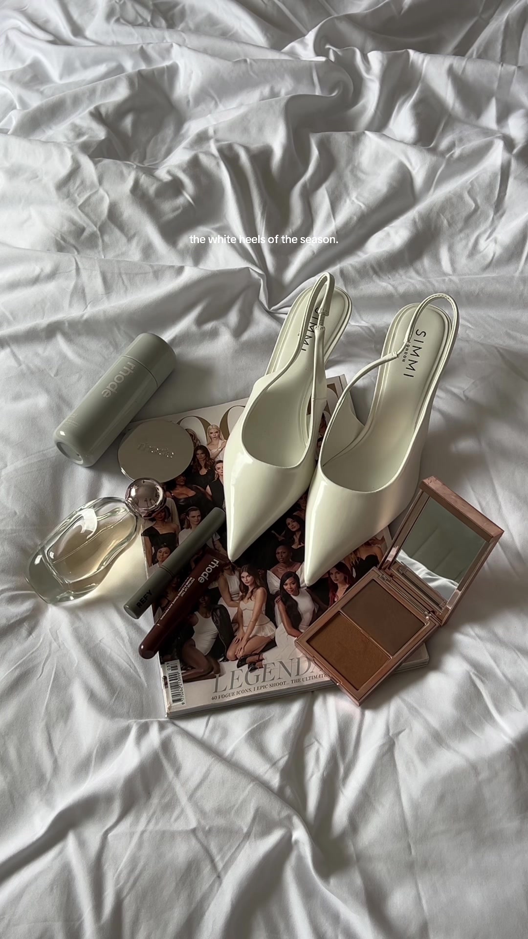 TikTok post by @nicolecoombes_ for Simmi London. Caption reads: A staple white heels 🪽🤍☁️ @SIMMILONDON....