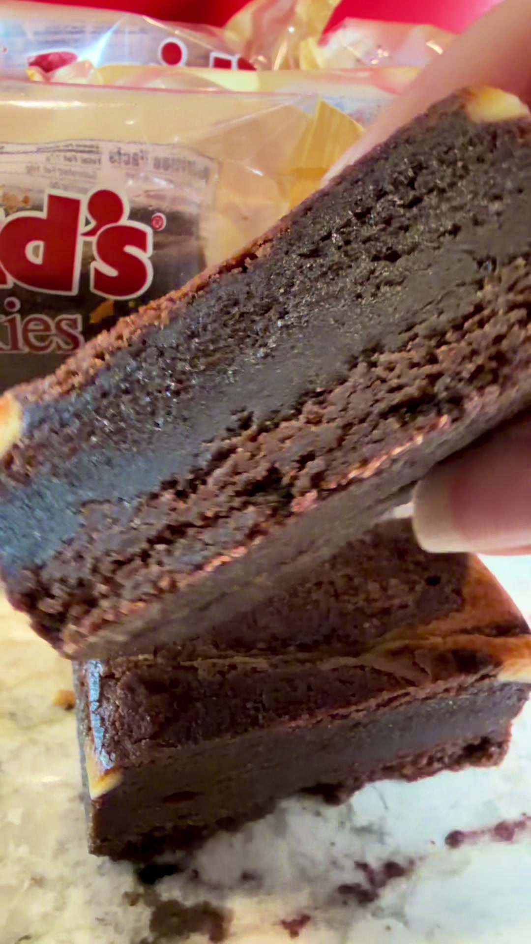 TikTok post by @klizzyyung for David's Cookies. Caption reads: I just tried these @David's Cookies cheesecake....