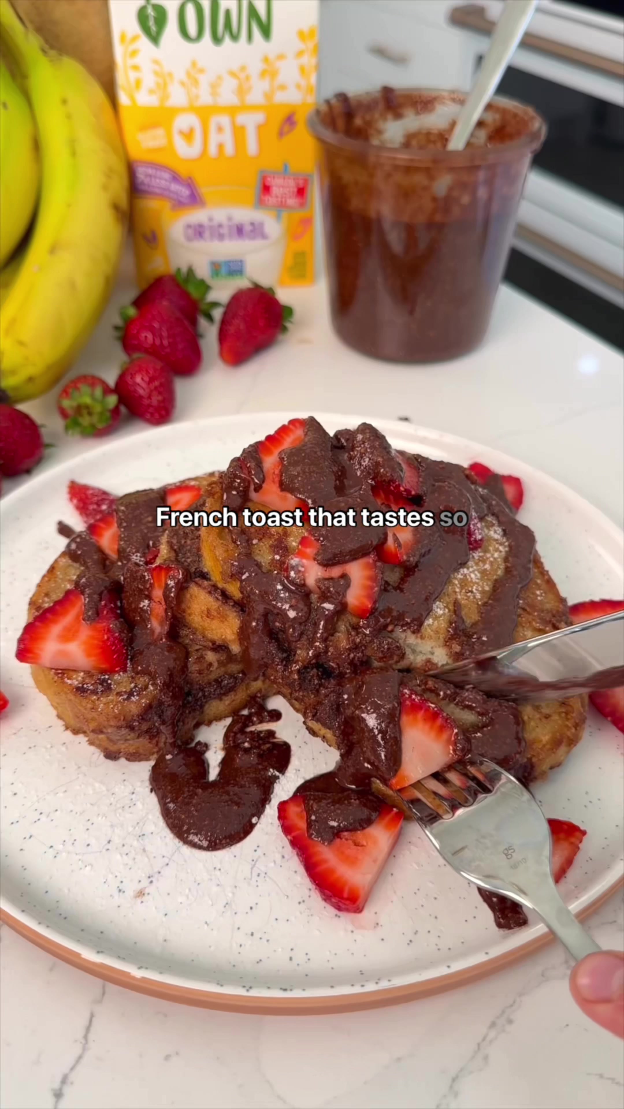TikTok post by @that.veganbabe for Earth’s Own. Caption reads: [...] = New Breakfast Obsession 🍫 Made with....