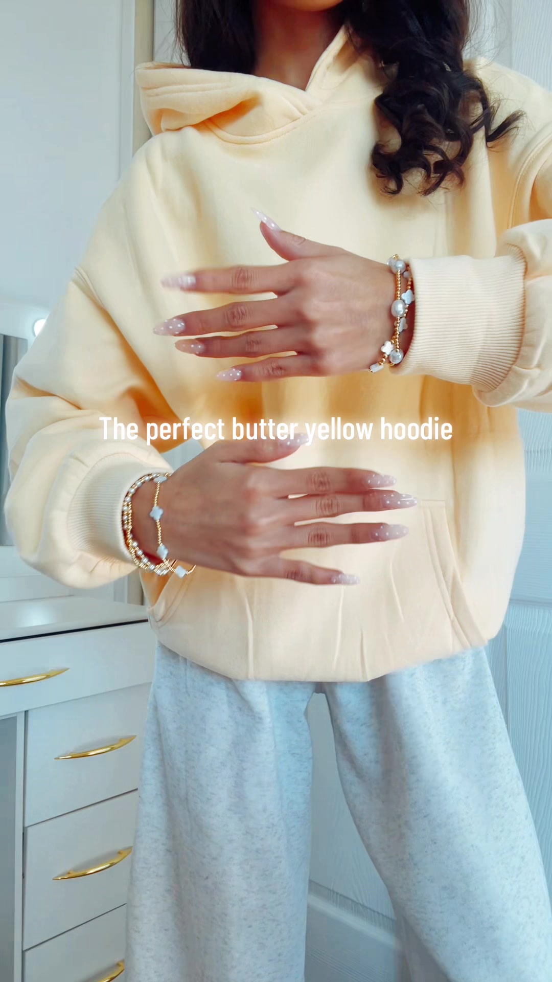 TikTok post by @..vlogswolivia for Automet. Caption reads: The perfect butter yellow hoodie!🌟 from @AUTOMET....