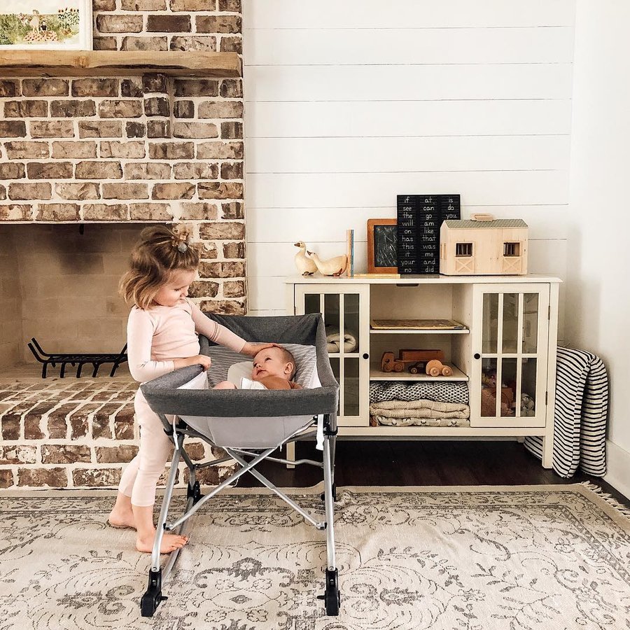 Instagram post by @its.rachelanne for Baby Delight. Caption reads: Nobody puts baby in a corner, but you sure do put....