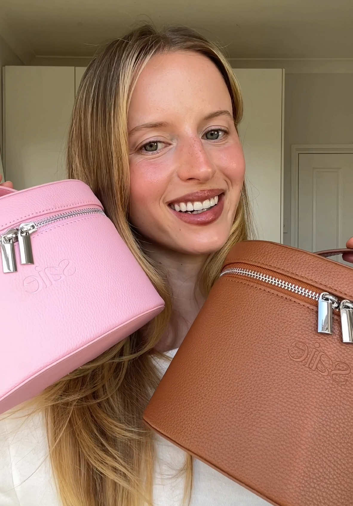 TikTok post by @hannahjuneva for Saie hello. Caption reads: the vanity case that comes with me everywhere I go....