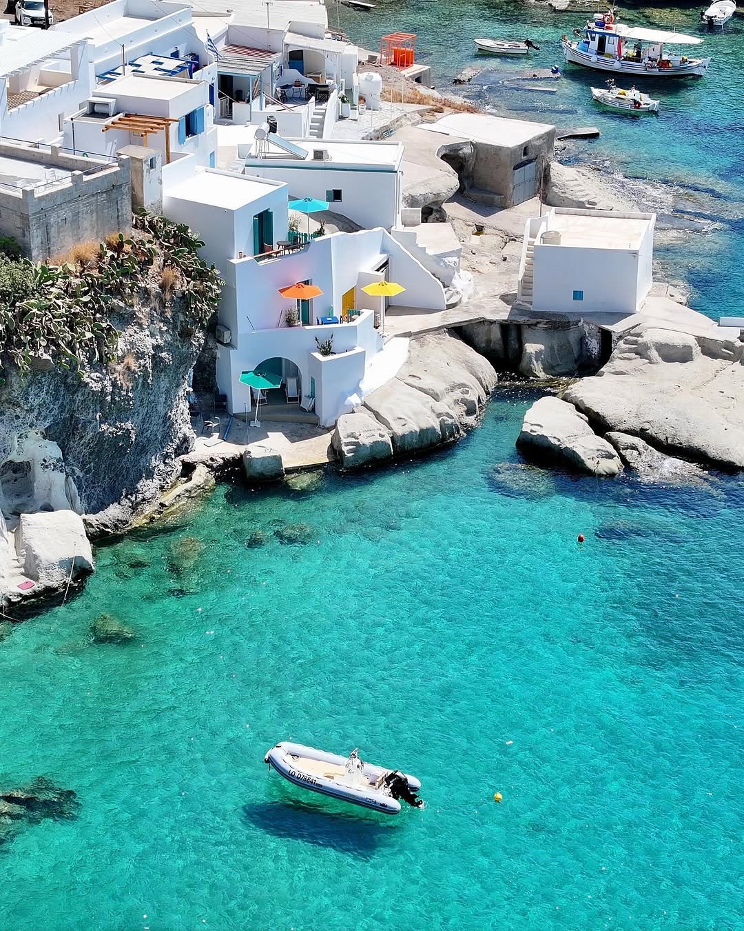 Instagram post by @katerinakatopis for Travel + Leisure. Caption reads: The heavenly little island of 📍Kimolos (Κίμωλος)....