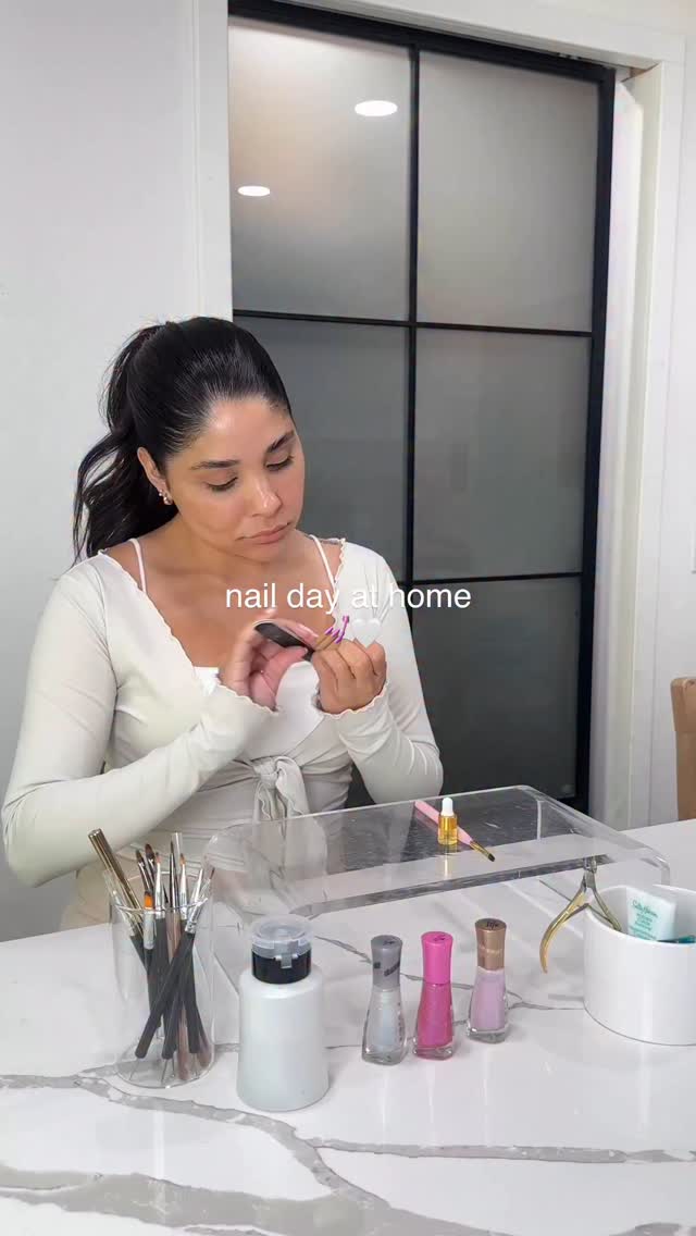 Instagram post by @angelaaxrenee for Sally Hansen. Caption reads: We have the salon at home 💅🏽✨ @sally_hansen....