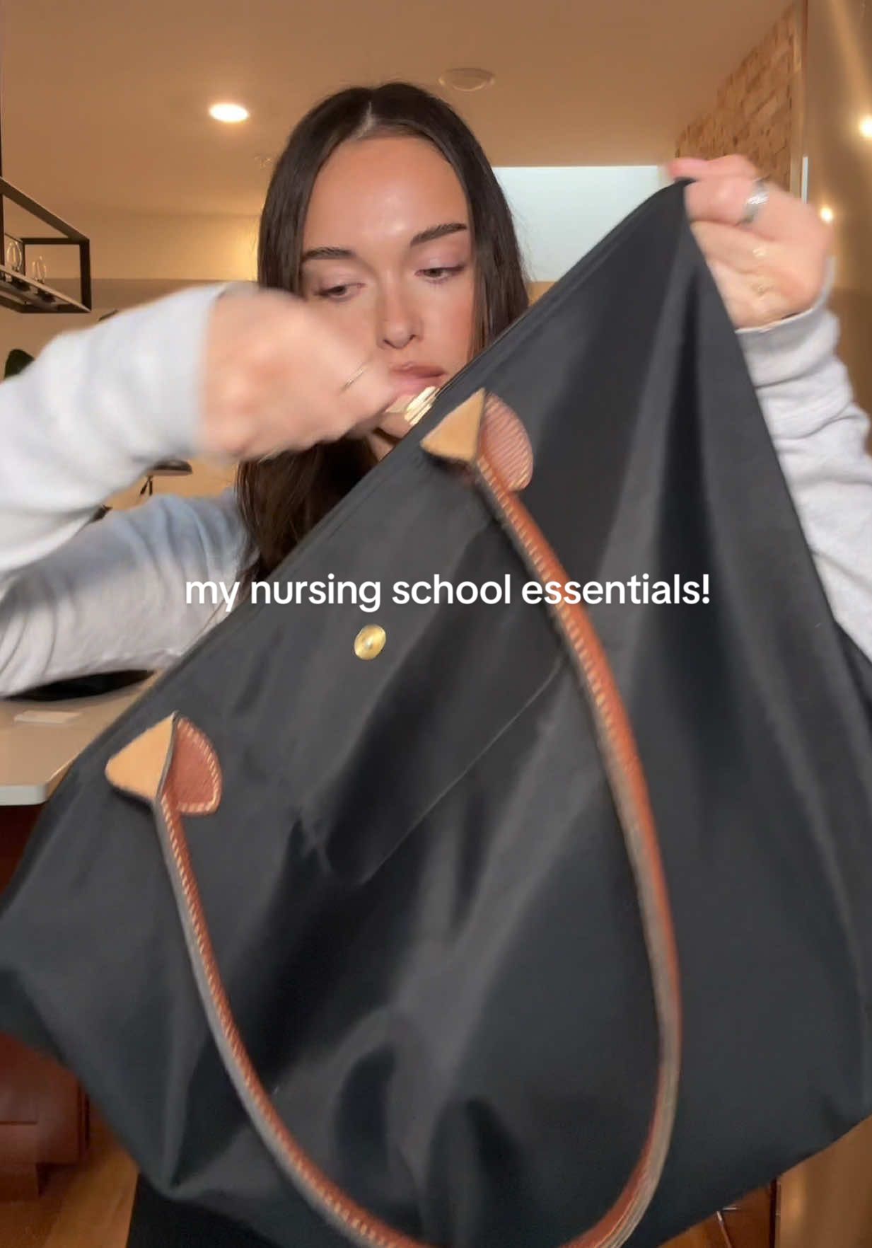 TikTok post by @leahleclerccc for Kleenex. Caption reads: [...] school essentials!! I love packing....