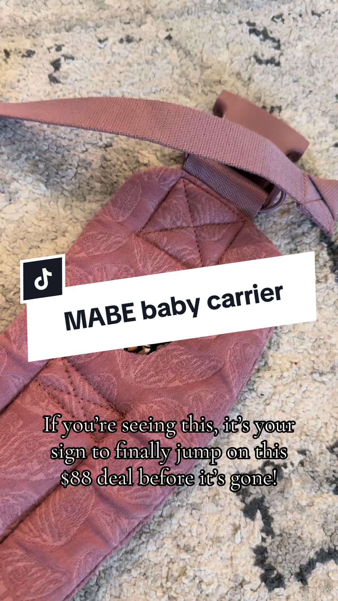 TikTok post by @genevieve.nicole for MABĒ Carriers. Caption reads: [...] #momtok #ttshopdeals #onsale @MABĒ Carriers.