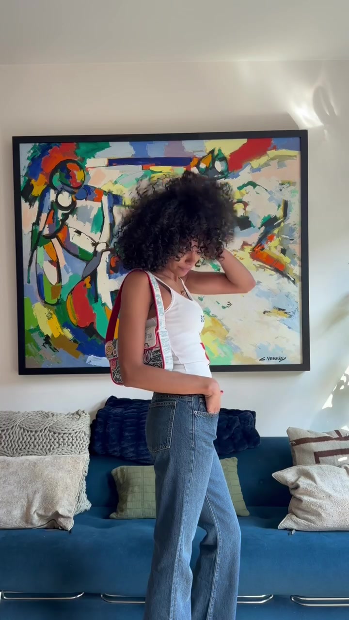 TikTok post by @oliviajoan18 for STAUD. Caption reads: @STAUD Tommys, styled my way🤍.