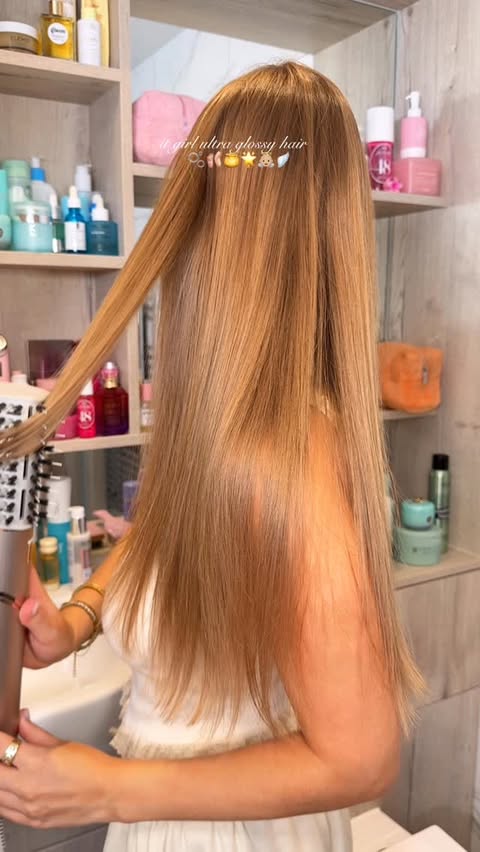 Instagram post by @byemmaleah for Kérastase. Caption reads: it girl ultra glossy hair 🫧🩰🍯🌟👼🏼🪽 products....
