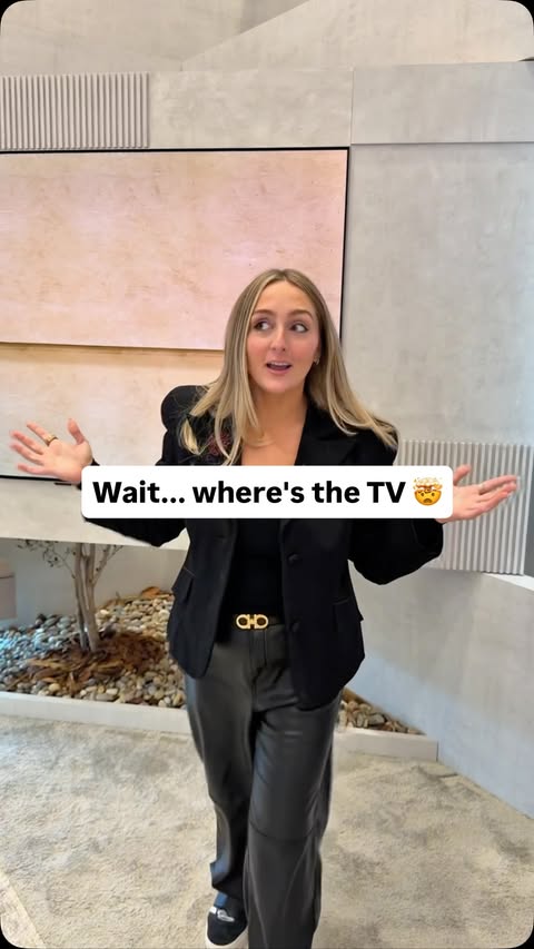 Instagram post by @katekozuch for LG USA. Caption reads: Is there actually a TV there 🤯 how cool is it....