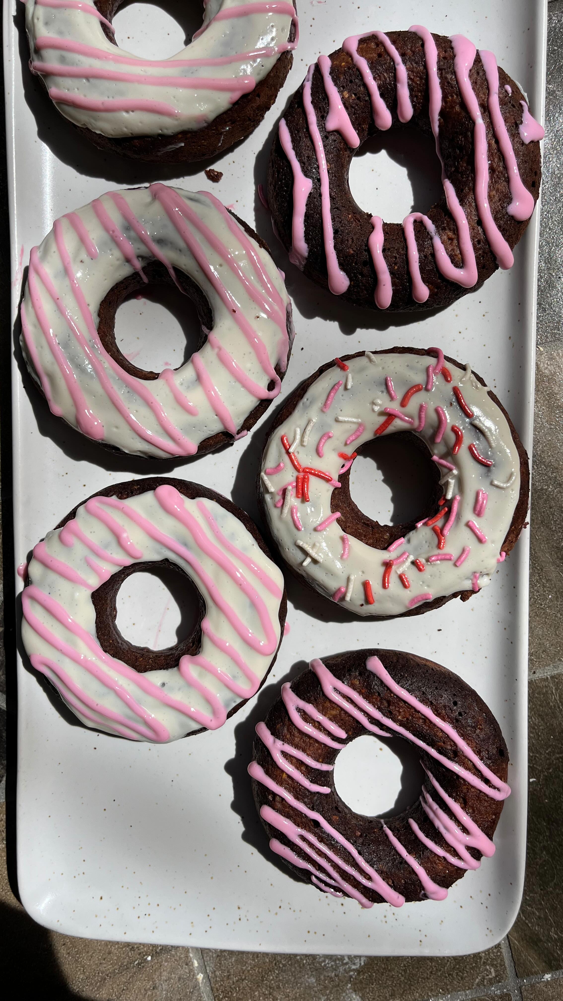 Instagram post by @regs_healthy_eats for Protein World. Caption reads: 🍩 STOP! These Chocolate Protein Donuts are the....