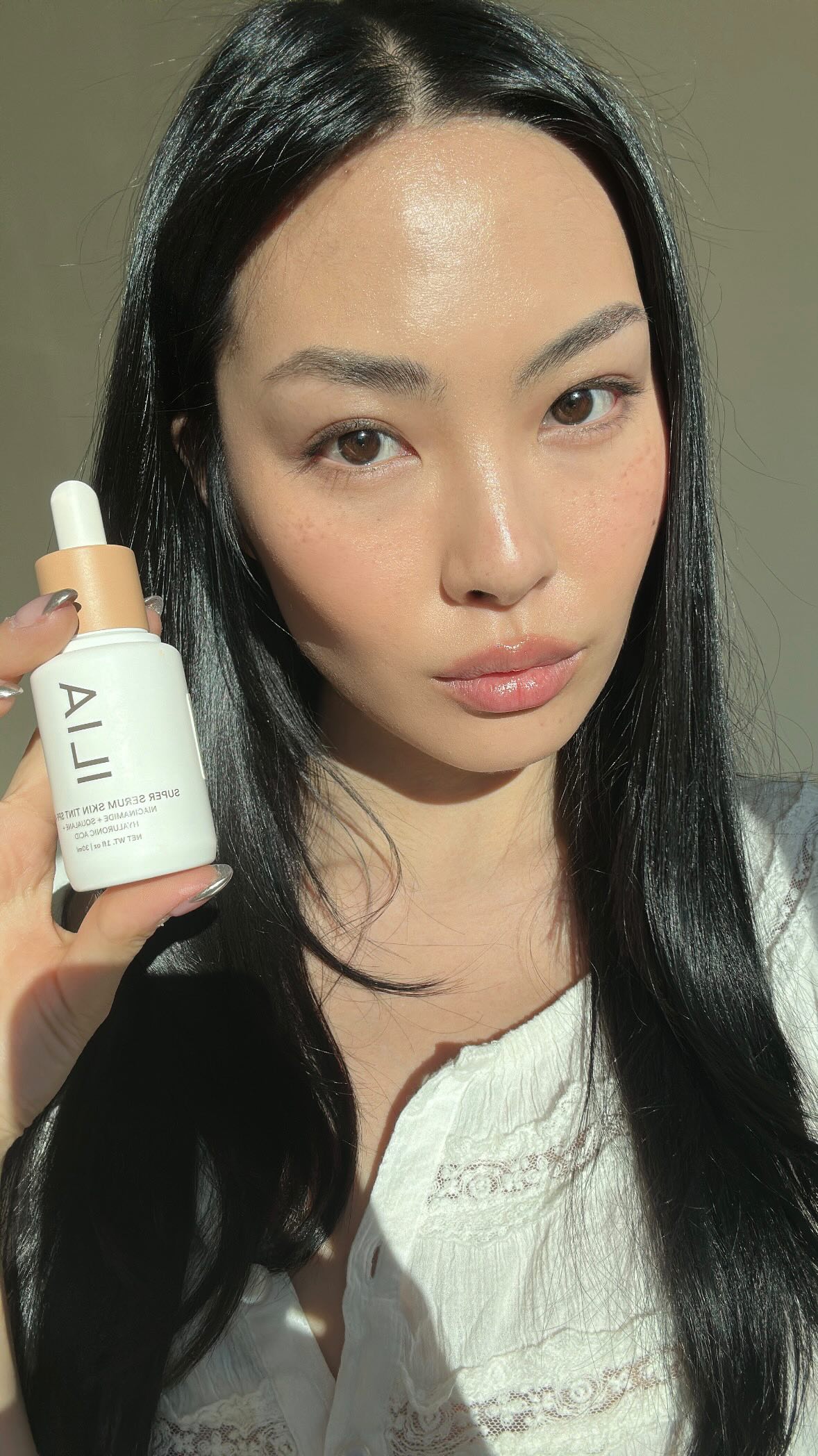 Instagram post by @shannon.z for ILIA Beauty. Caption reads: Tinted skincare 🤍 @iliabeauty #IliaBeautyPartner.