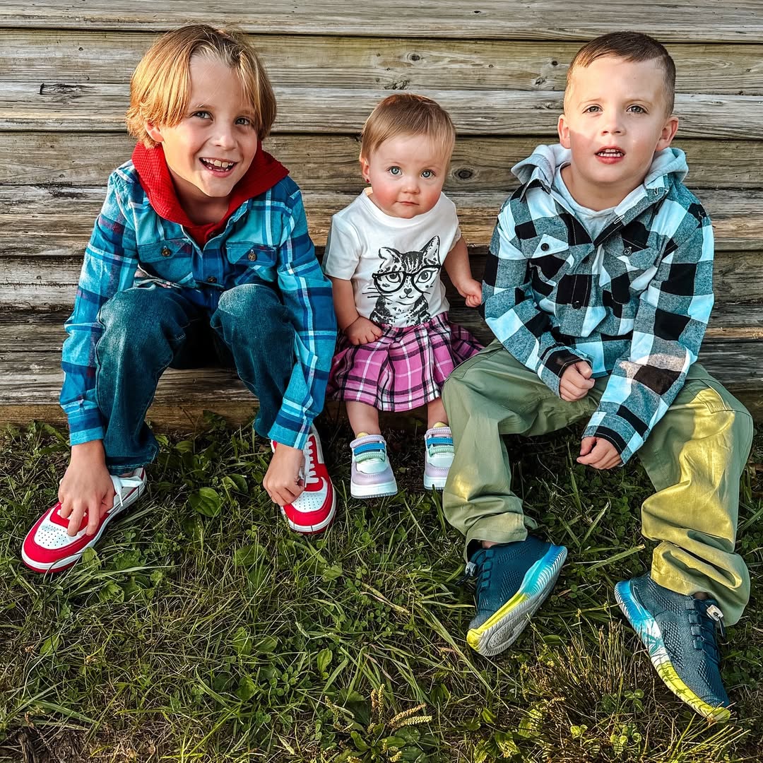 Instagram post by @dunnfamilyfun for FabKids. Caption reads: Lookin fab in their plaid! 🌼 
#ad The kids are....