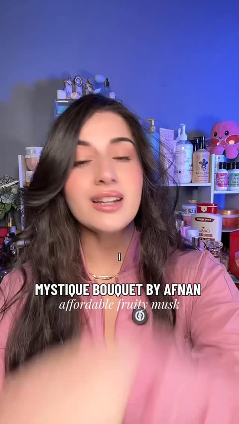 Instagram post by an influencer for Afnan Perfumes. Caption reads: REVIEWING MYSTIQUE BOUQUET BY AFNAN #sponsored....