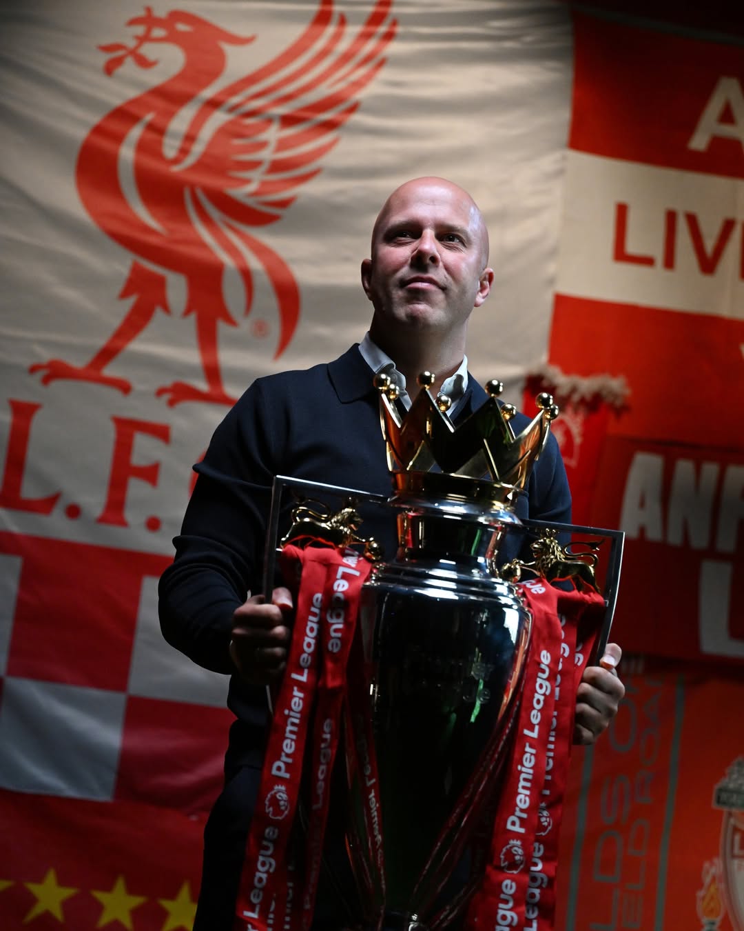 Instagram post by @liverpoolfc for Premier League. Caption reads: 📸🏆.