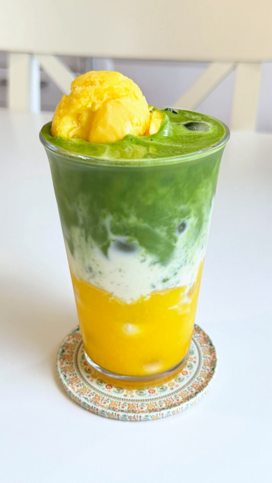 Instagram post by @matchagirlie1 for Nioteas. Caption reads: The creamiest Mango Matcha 🥭 it tasted like a....