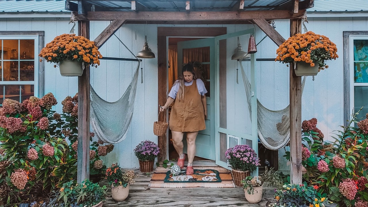 YouTube post by @HEYWANDERER for Azure Standard. Caption reads: Rainy Days Off Grid: Cozy Sewing & Cabin Building.