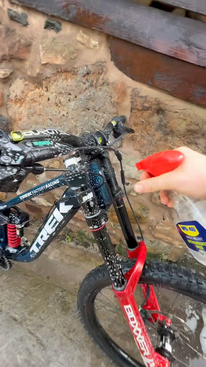 Instagram post by @trekfactoryracingdh for WD-40. Caption reads: @trekfactoryracingdh have squeezed a week of....