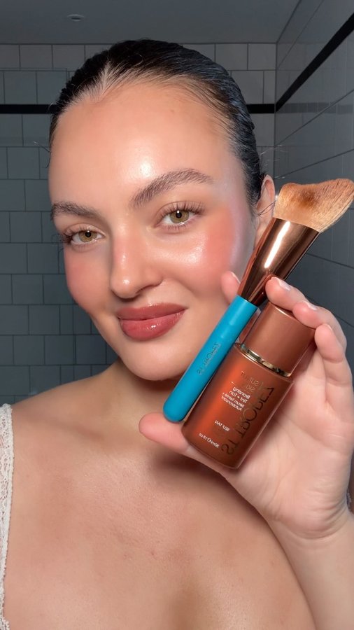 Instagram post by @caressmd for St.Tropez. Caption reads: ad i’m obsessed!! instant sun kiss using....