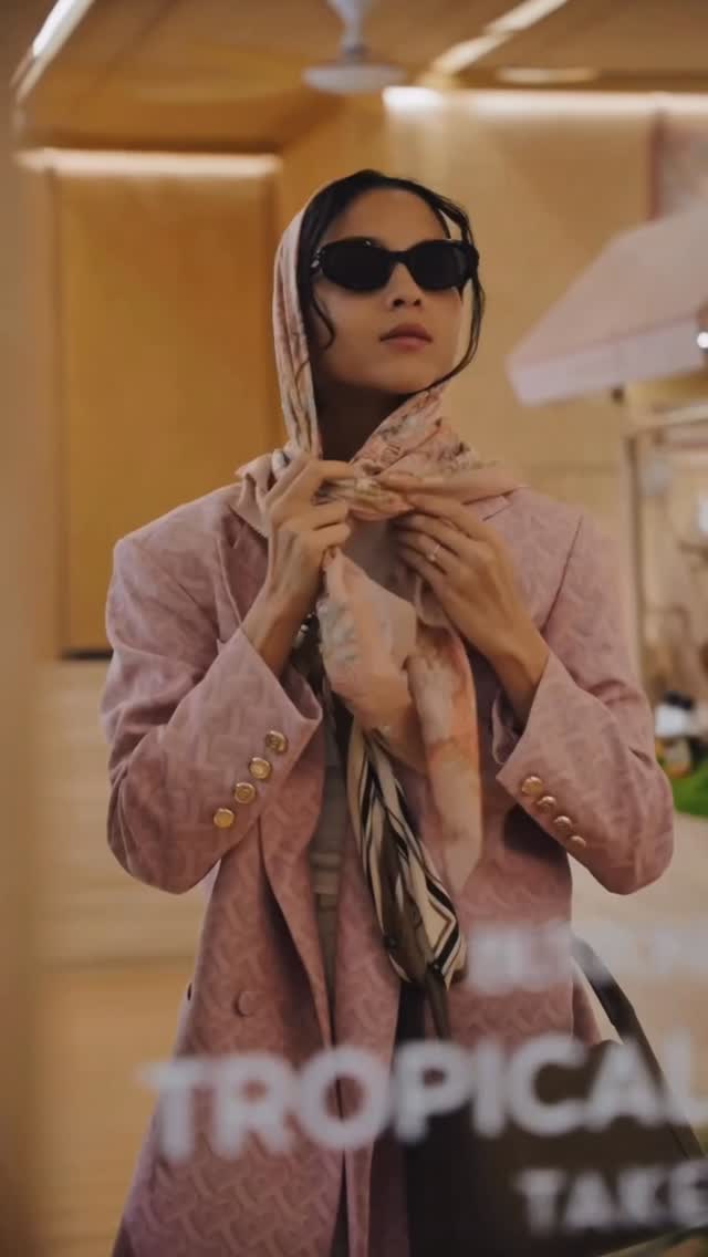 Instagram post by @putrimarino for BUTTONSCARVES. Caption reads: Tropical Paradise Takeover by @buttonscarves.