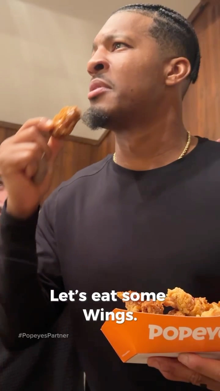 Instagram post by @jaboowins for Popeyes. Caption reads: Let’s Eat One #PopeyesPartner.