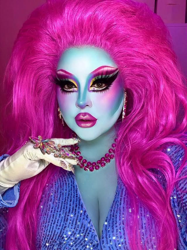 Instagram post by @cremefatale for PinkyParadise. Caption reads: [...] 1980s diva 🐬💜💞✨ @wigsbytips Wig....