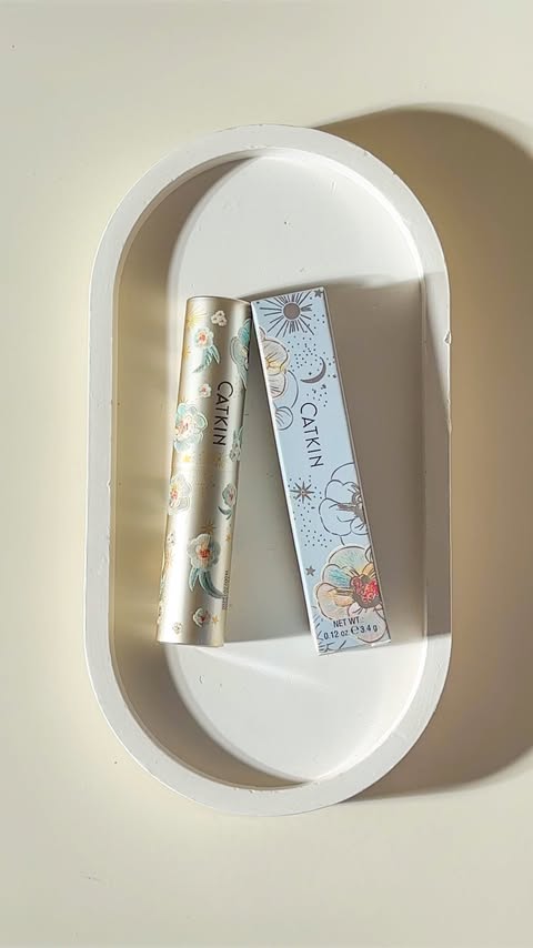 Instagram post by @grasiapper for Catkin. Caption reads: 🌷 Catkin Glossy Lip Balm #CO2 Tulip 🛍️Available....