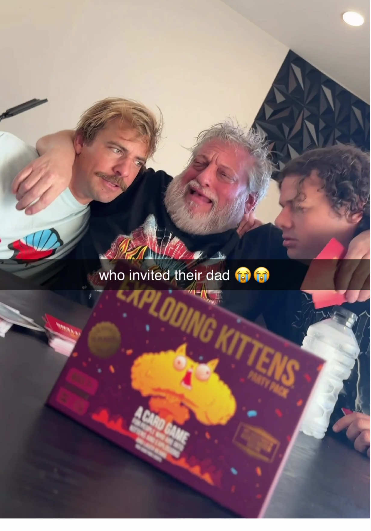 TikTok post by @cherdleys for Exploding Kittens. Caption reads: It’s just a game, dad 😭🥺 @Exploding Kittens,....