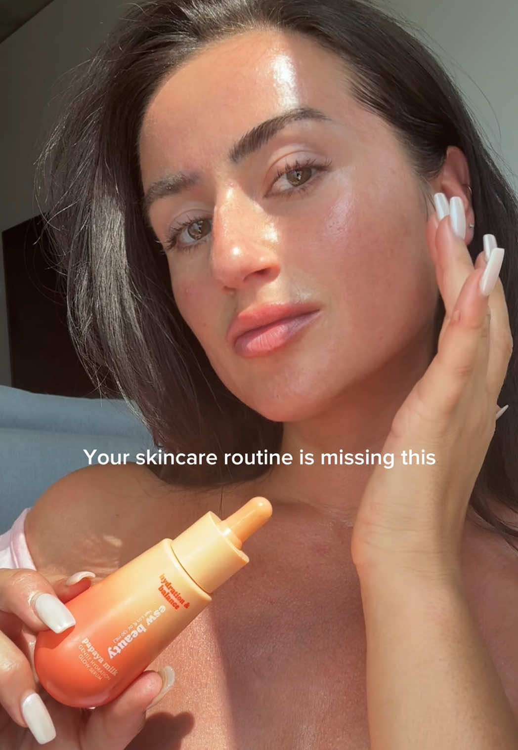 TikTok post by @sabinaalexiia for ESW Beauty. Caption reads: [...] the lightweight, milky texture of the @ESW....