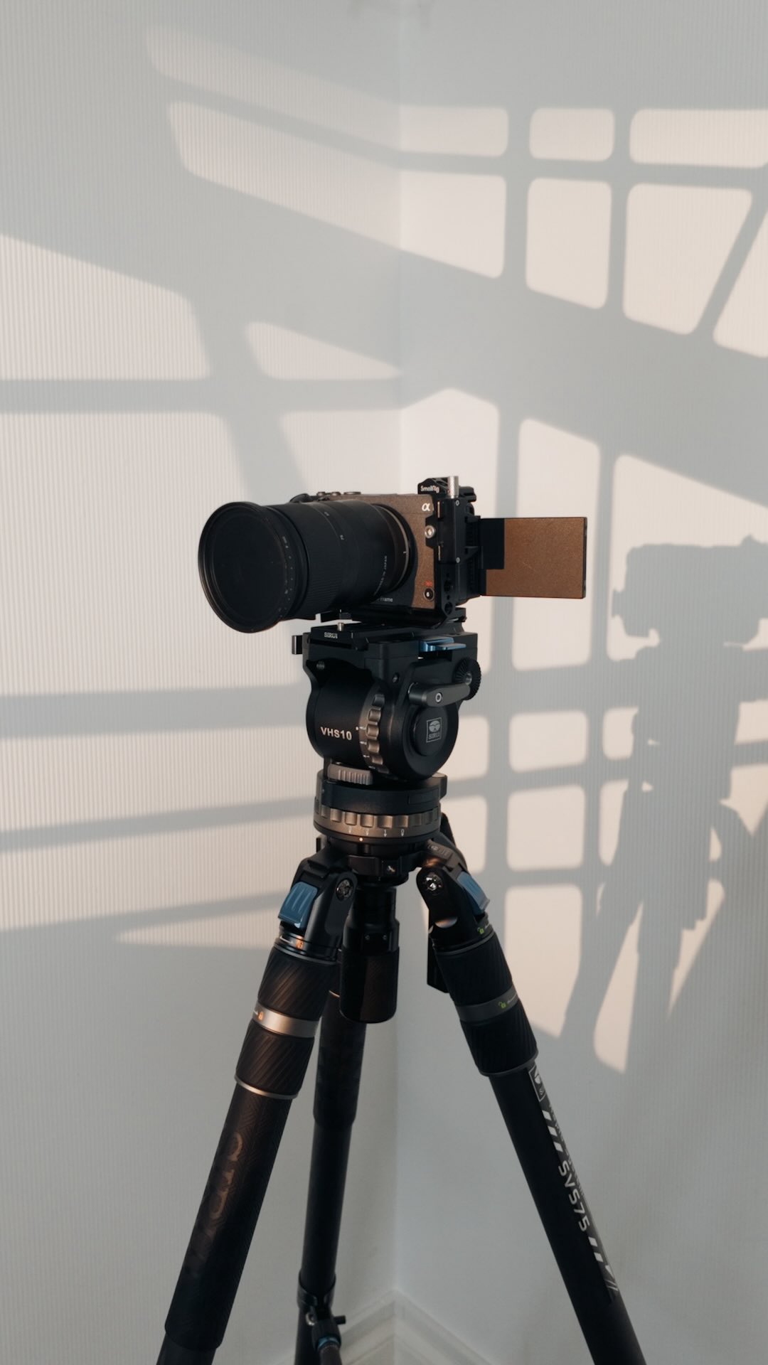 Instagram post by @danielgrindrod for SIRUI Imaging. Caption reads: Stop fumbling with flip-locks. This is the fastest....