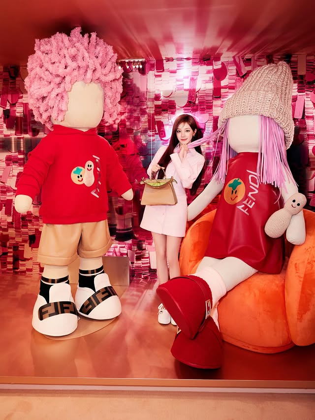 Instagram post by @yuqisong.923 for Fendi. Caption reads: @fendi 
🧡With my BFF🧡.