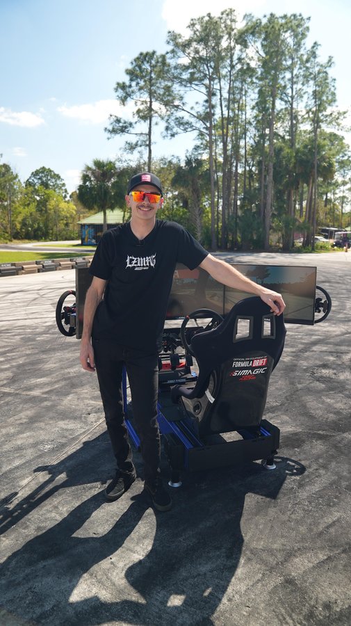 Instagram post by @adam_lz for Simagic. Caption reads: Stoked to announce I’ve partnered with....