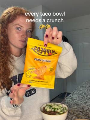 TikTok post by @maddie.shampoo for HIPPEAS. Caption reads: My go-to for a crunch in a taco bowl 🌮🌮@HIPPEAS....