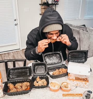 Instagram post by @cantguard_malik for Popeyes. Caption reads: #PopeyesPartner Everybody knows how much I love my....