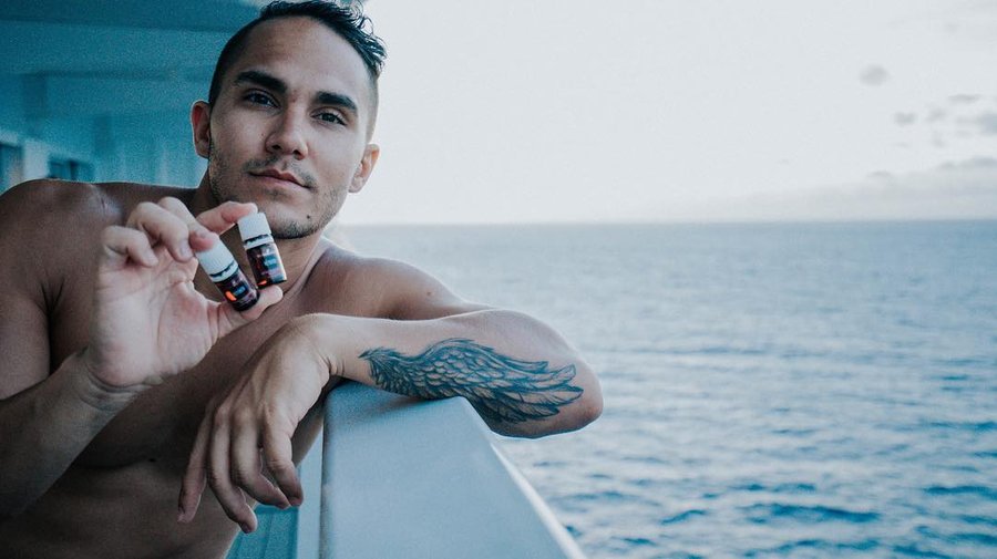 Instagram post by @therealcarlospena for Young Living. Caption reads: Something about me... (if you don’t know it....