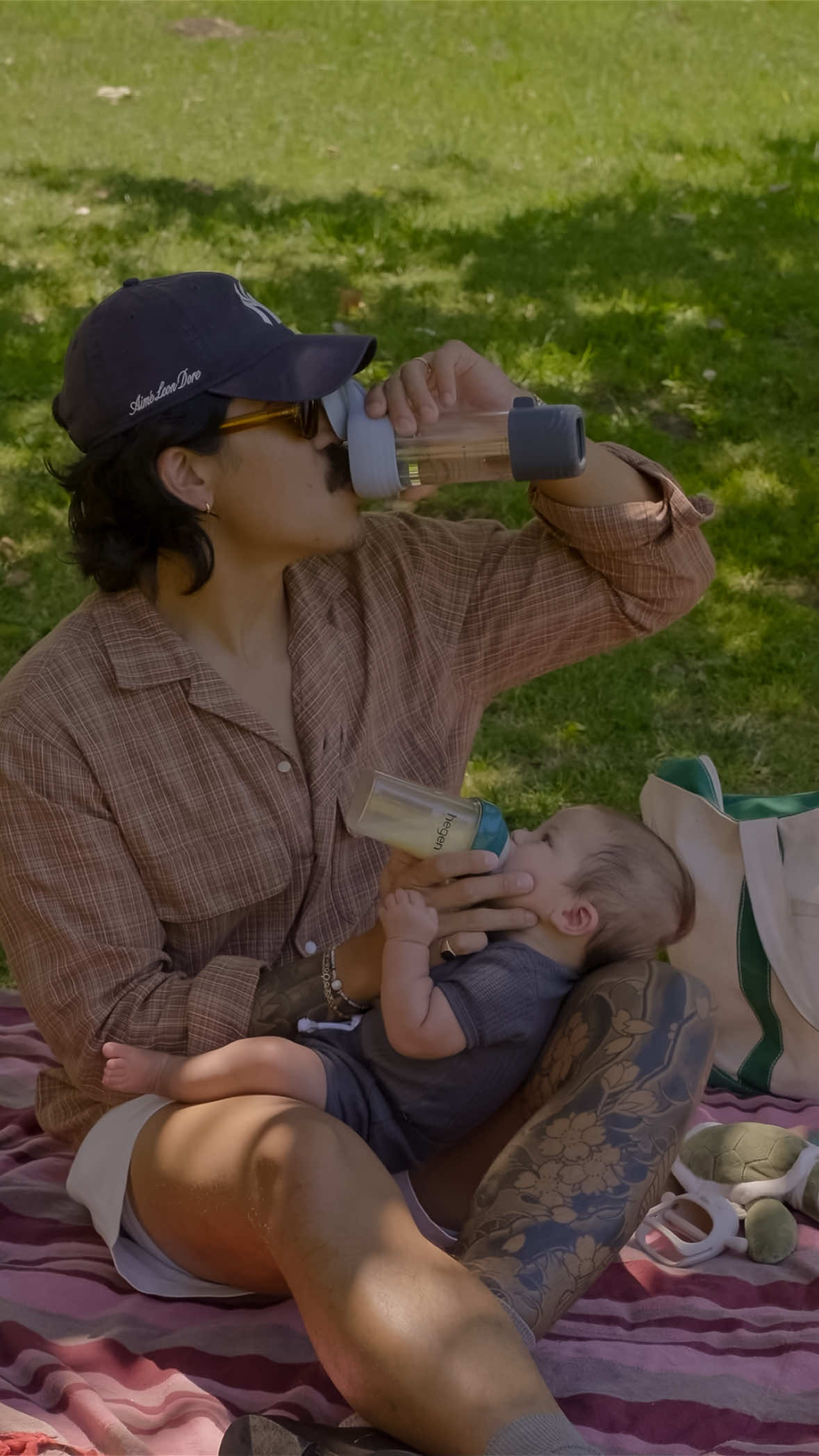 TikTok post by @mr.bthompson for Hegen. Caption reads: Dad duties made easy with @Hegen USA 8oz feeding....