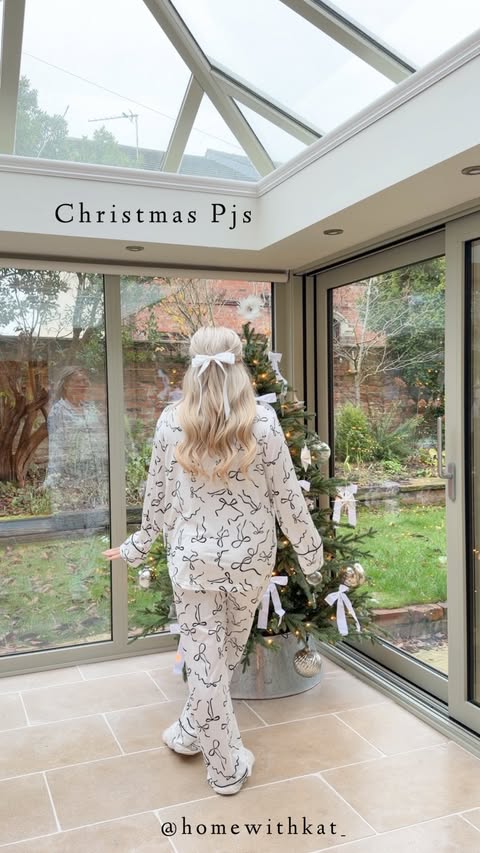 Instagram post by @homewithkat_ for Peacocks. Caption reads: Watch until the end 🥹✨ CHRISTMAS PJS FOR THE....