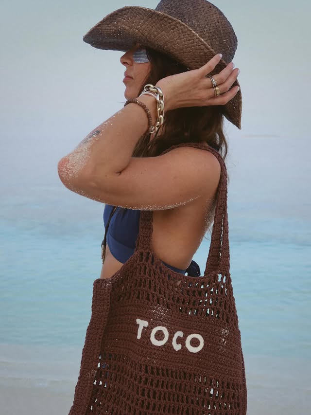 Instagram post by an influencer for Toco Swim. Caption reads: [...] 🐬 #bucketlistmoment @tocoswim ad.