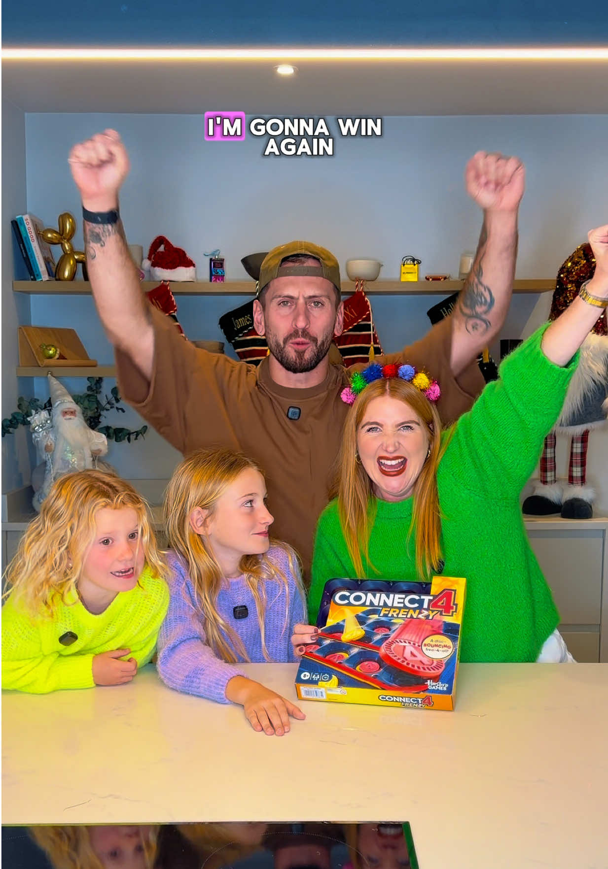 TikTok post by @theldnfamily for Hasbro. Caption reads: #AD If your family gets competitive at Christmas…....