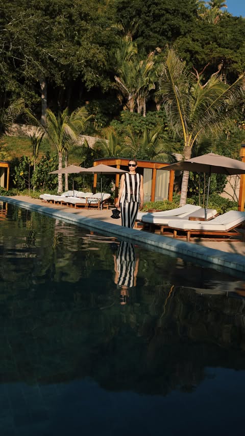 Instagram post by @juliacomil for ZIMMERMANN. Caption reads: @rosewoodmandarina: White Lotus Paradise without....